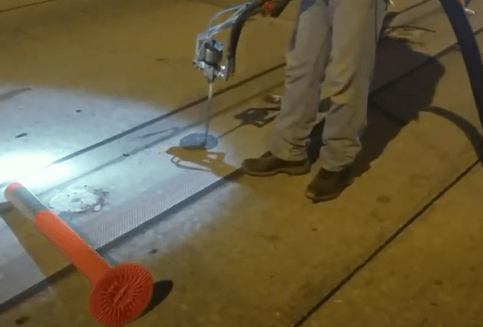 Firmmarker Road Marker Adhesive being applied